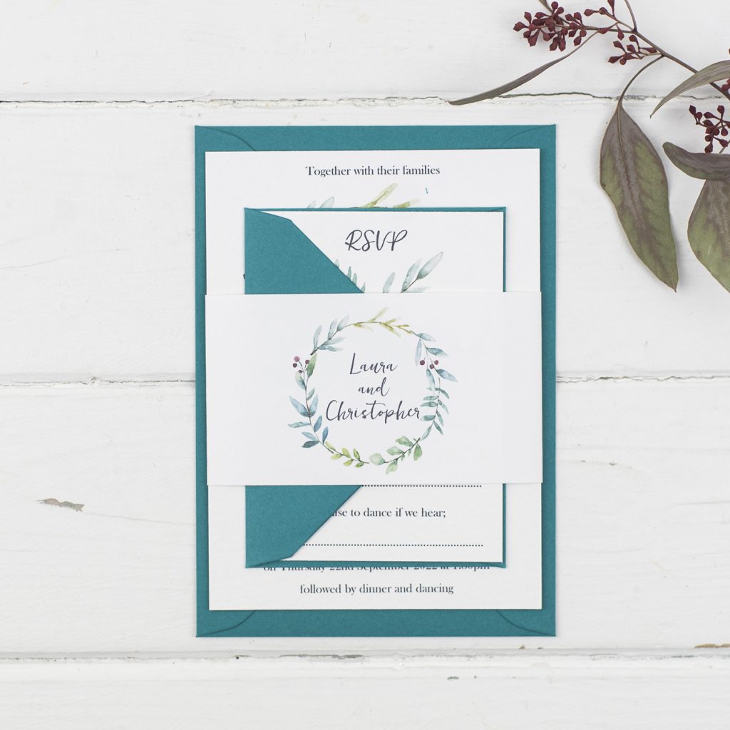 types of wedding invitations handmade invite rsvp bellyband white textured painted foliage wreath teal envelopes