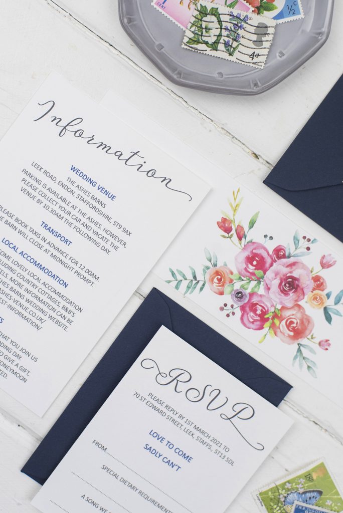 handmade wedding invites white navy painted colourful florals information bellyband rsvp