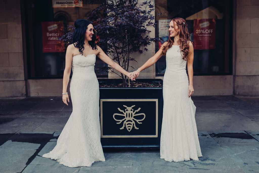 wedding checklist bride and bride holding hands city centre