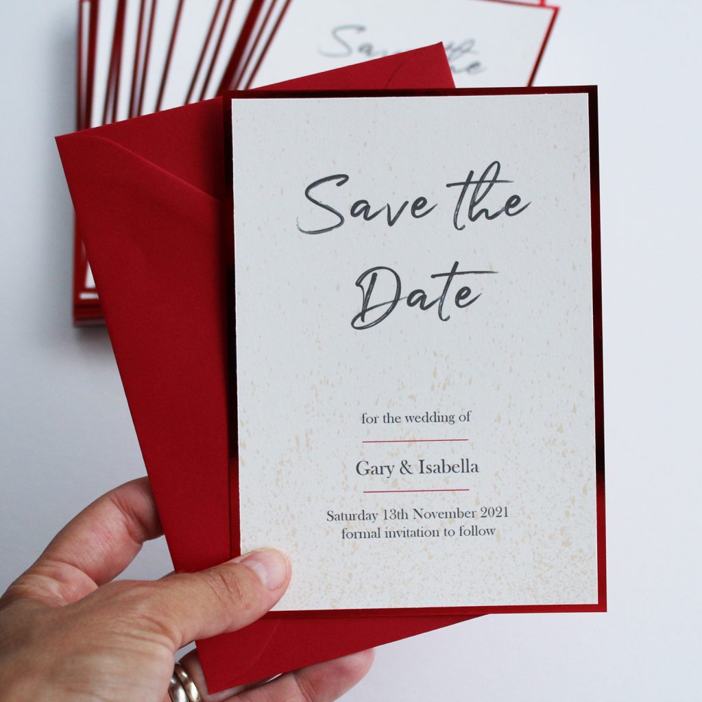 save the date ivory card red shiny edge red envelope hand held