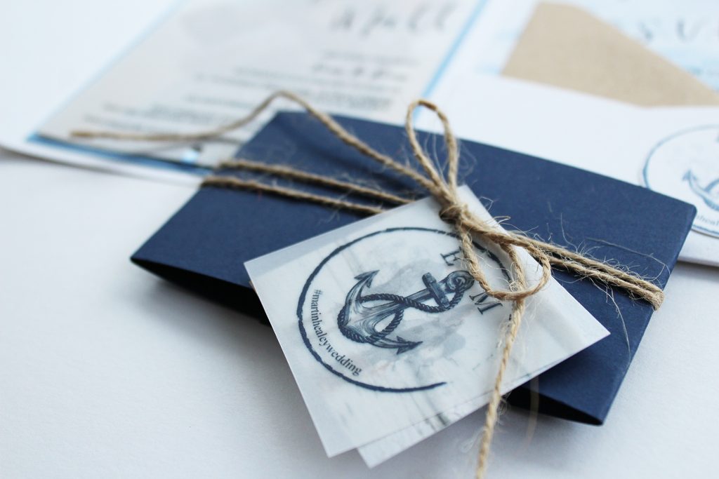 diy wedding invitations detail image navy belly band twine bow vellum logo tag