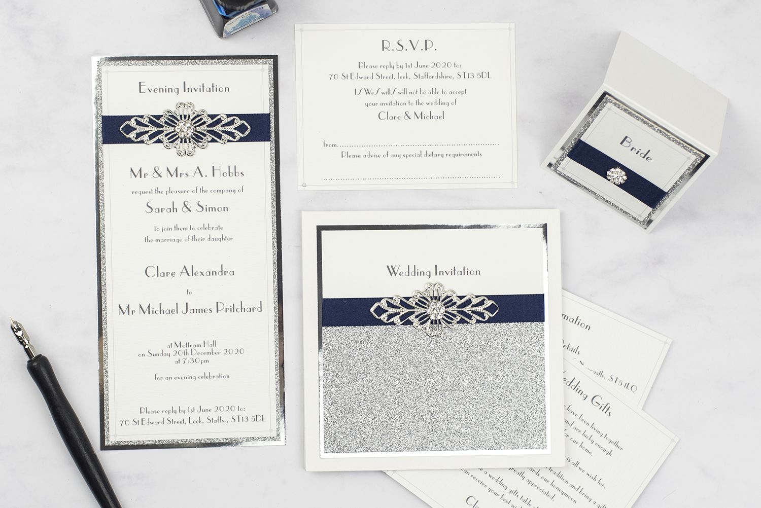 luxury wedding invites invitation suite flatlay silver foil glitter crystal embellishment navy ribbon 