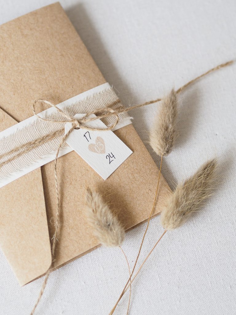 offset image pocketfold wedding invitation caramel colour bellyband linen twine date tag bunny tails 